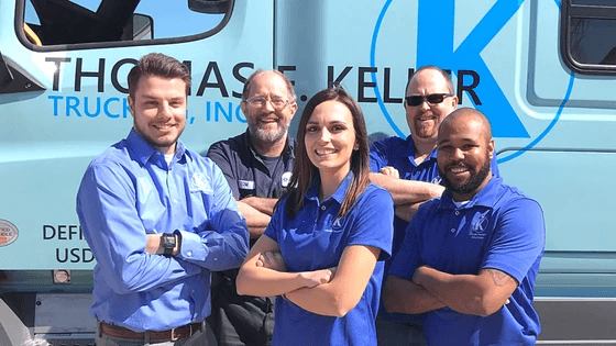 5 Keller employees posing with crossed arms in front of a Keller truck