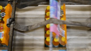 package of V8 bottles running through a machine
