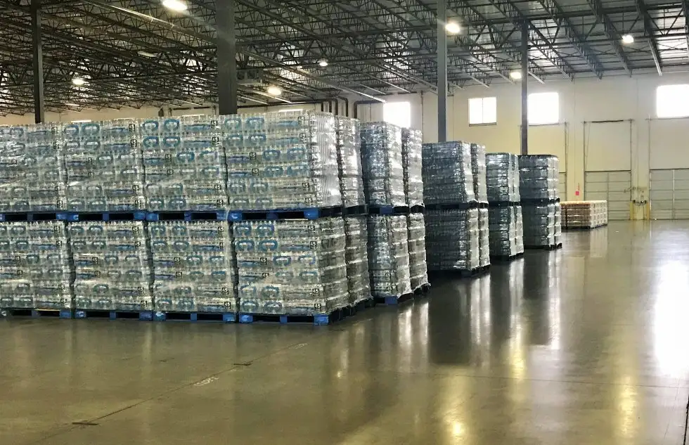 Rows of pallets of water in a Houston Warehouse