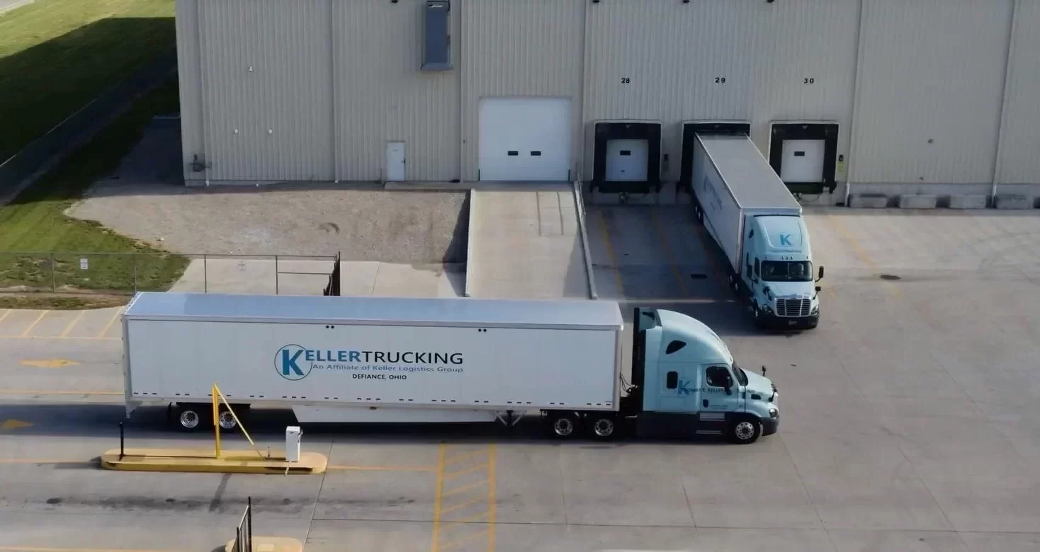 Keller Trucking truck pulling into warehouse loading dock area