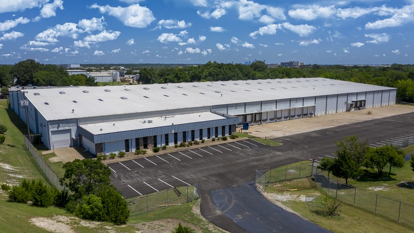 drone photo of the outside of a warehouse facility